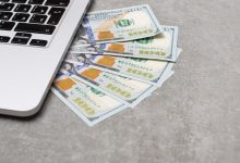 money under laptop business and finance concept picture id1167821047