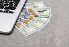 money under laptop business and finance concept picture id1167821047 w1200